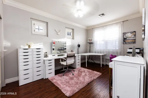 a room with cabinets and view of living room