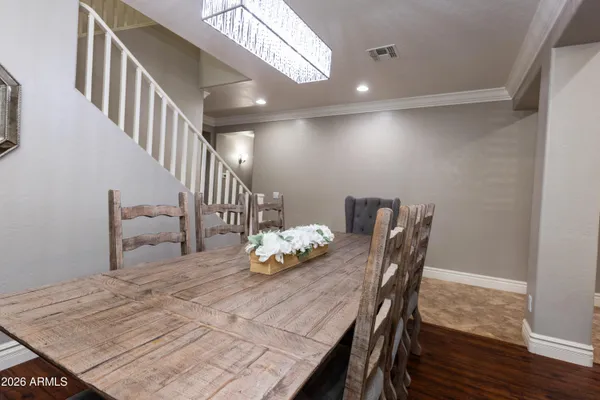 a view of a dining room with furniture and wooden floor