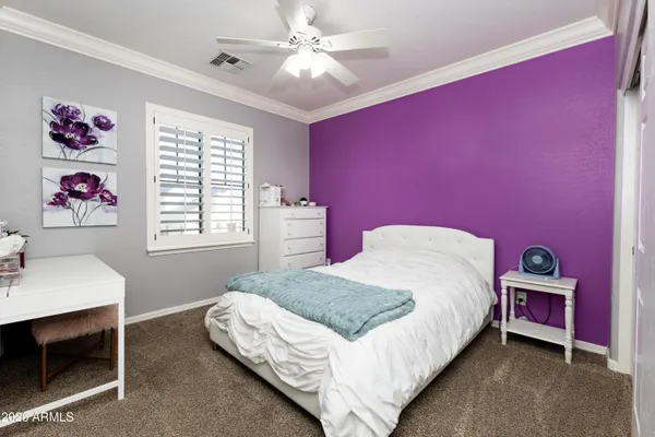 a bedroom with a bed and a table