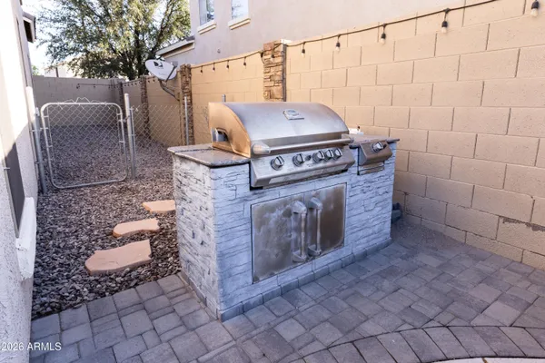 a stove top oven sitting inside of a kitchen