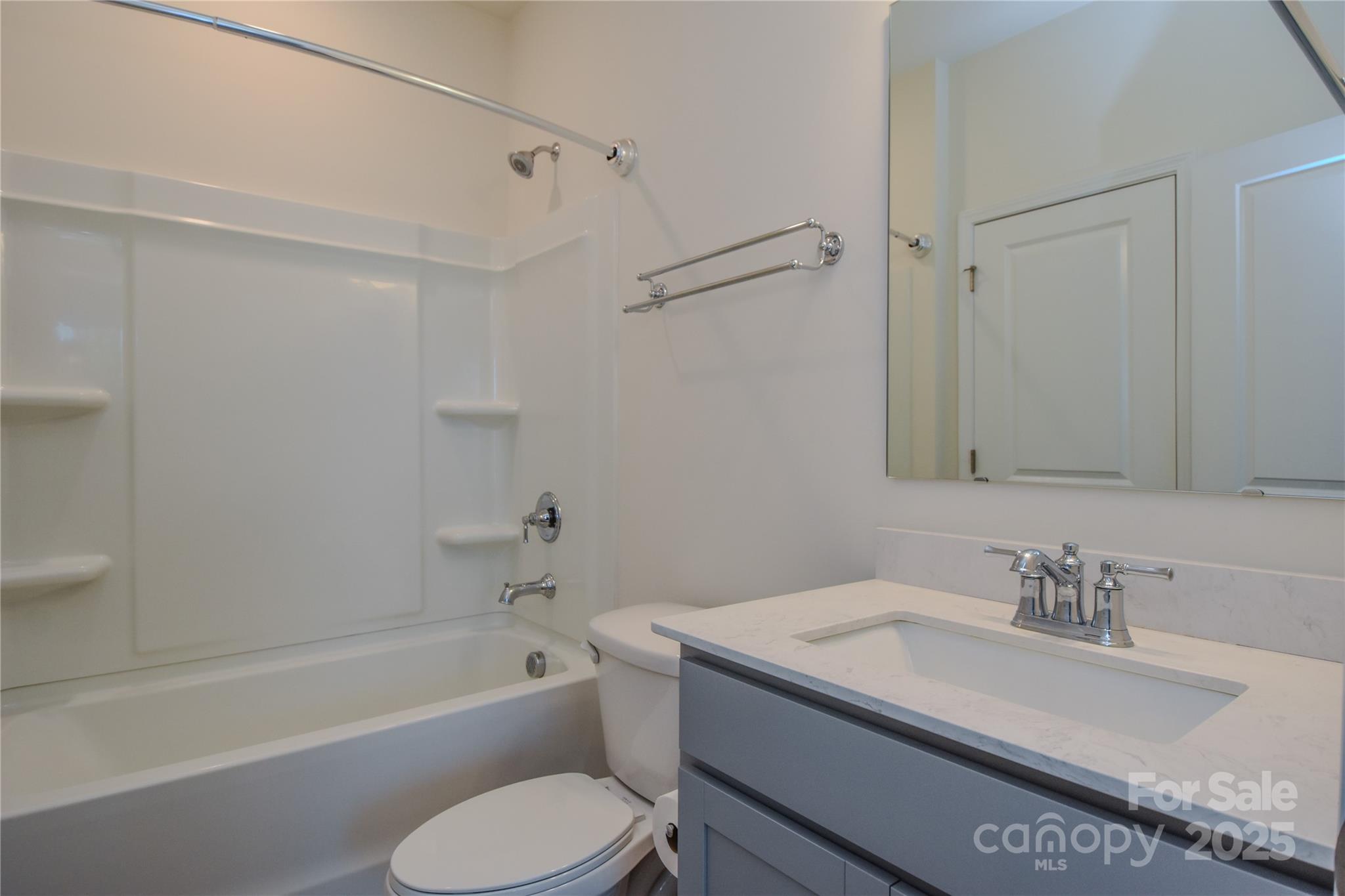 139 West Neel Ranch Road Mooresville, NC 28115 - Photo 16 of 40 a bathroom with a granite countertop sink toilet and bathtub