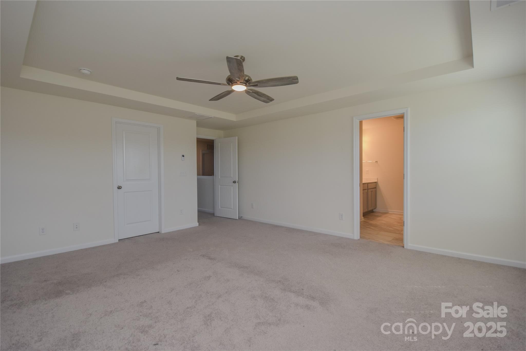139 West Neel Ranch Road Mooresville, NC 28115 - Photo 19 of 40 an empty room with a ceiling fan and closet area