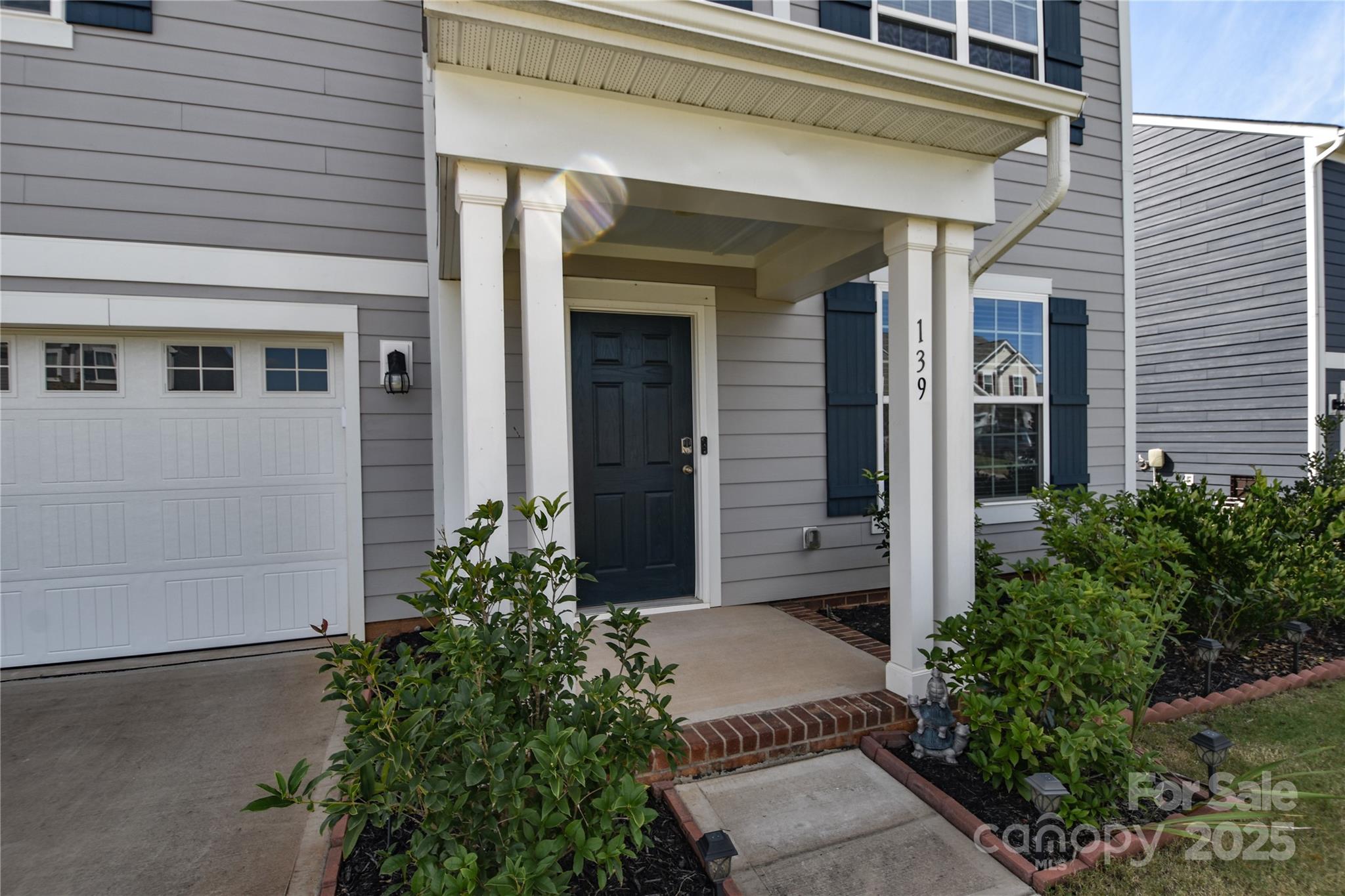 139 West Neel Ranch Road Mooresville, NC 28115 - Photo 2 of 40 front view of a house with potted plants