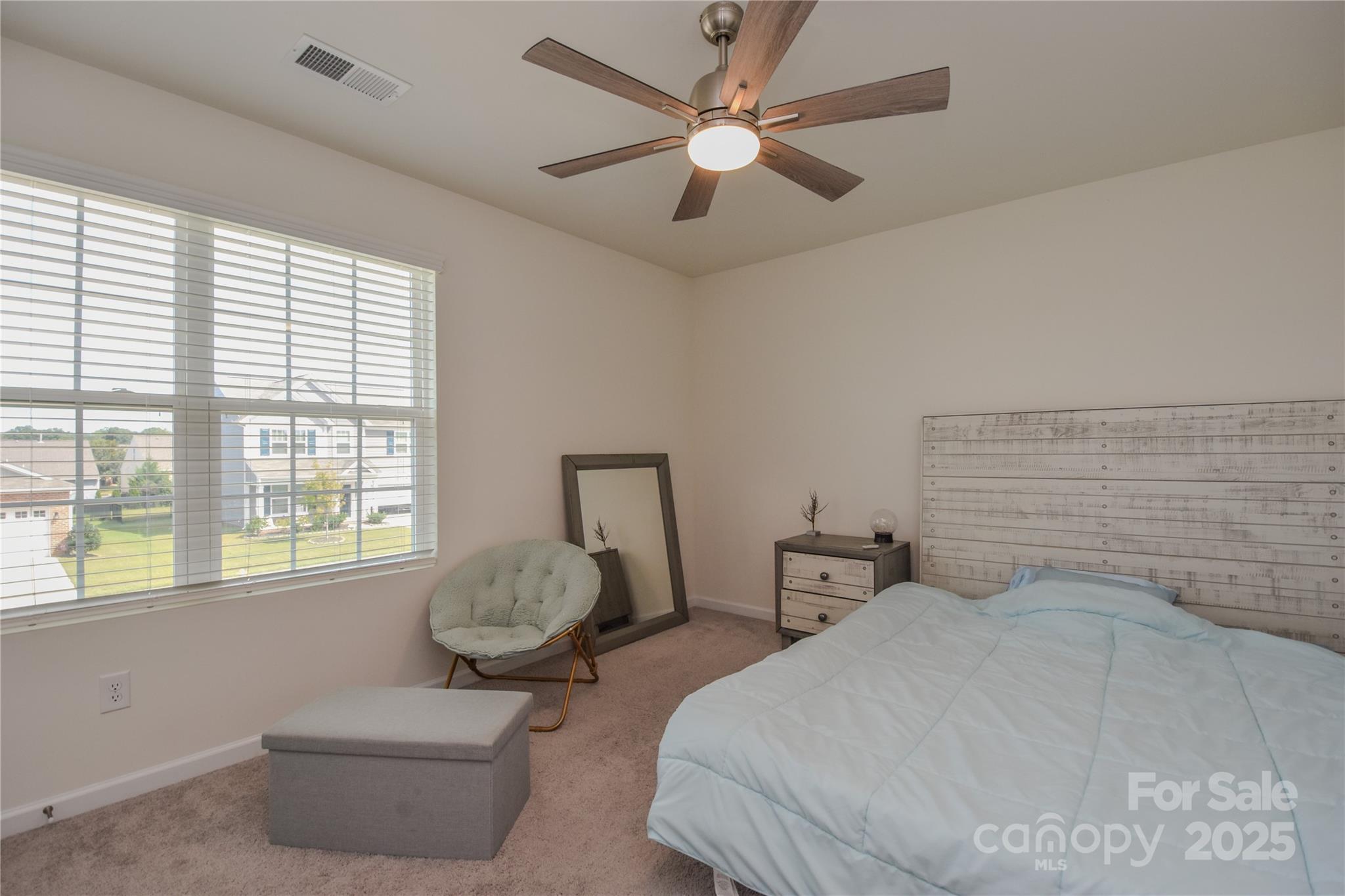 139 West Neel Ranch Road Mooresville, NC 28115 - Photo 26 of 40 a bedroom with bed and window