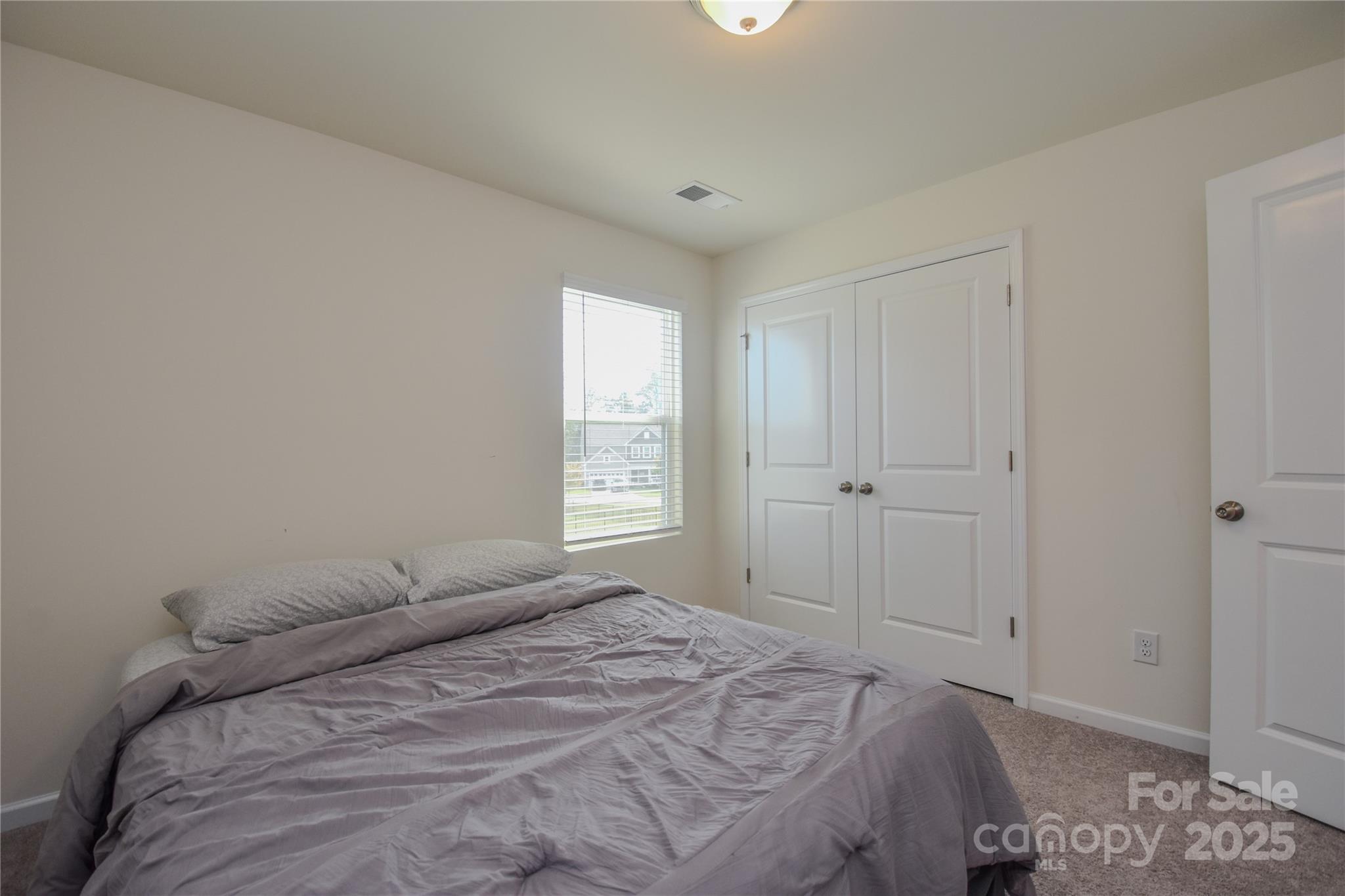139 West Neel Ranch Road Mooresville, NC 28115 - Photo 29 of 40 a bedroom with a bed and a window