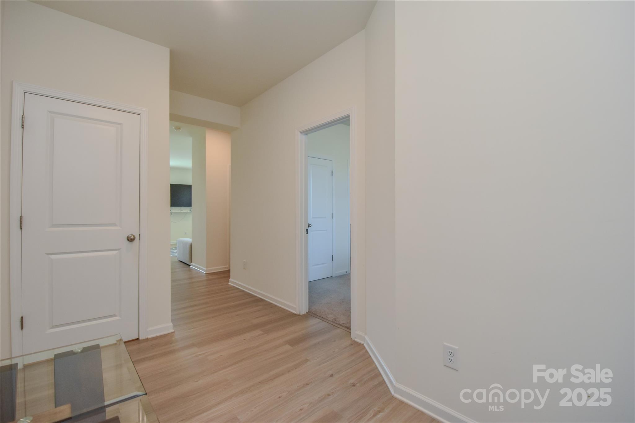139 West Neel Ranch Road Mooresville, NC 28115 - Photo 3 of 40 a view of a hallway with wooden floor