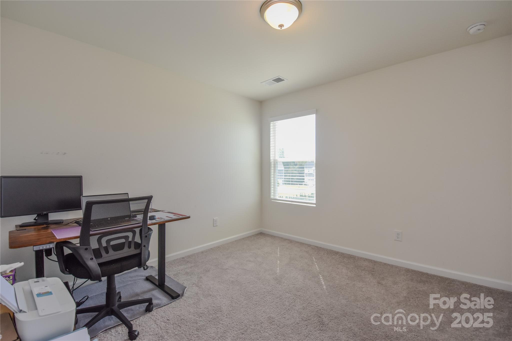 139 West Neel Ranch Road Mooresville, NC 28115 - Photo 31 of 40 a view of a workspace with furniture and a window