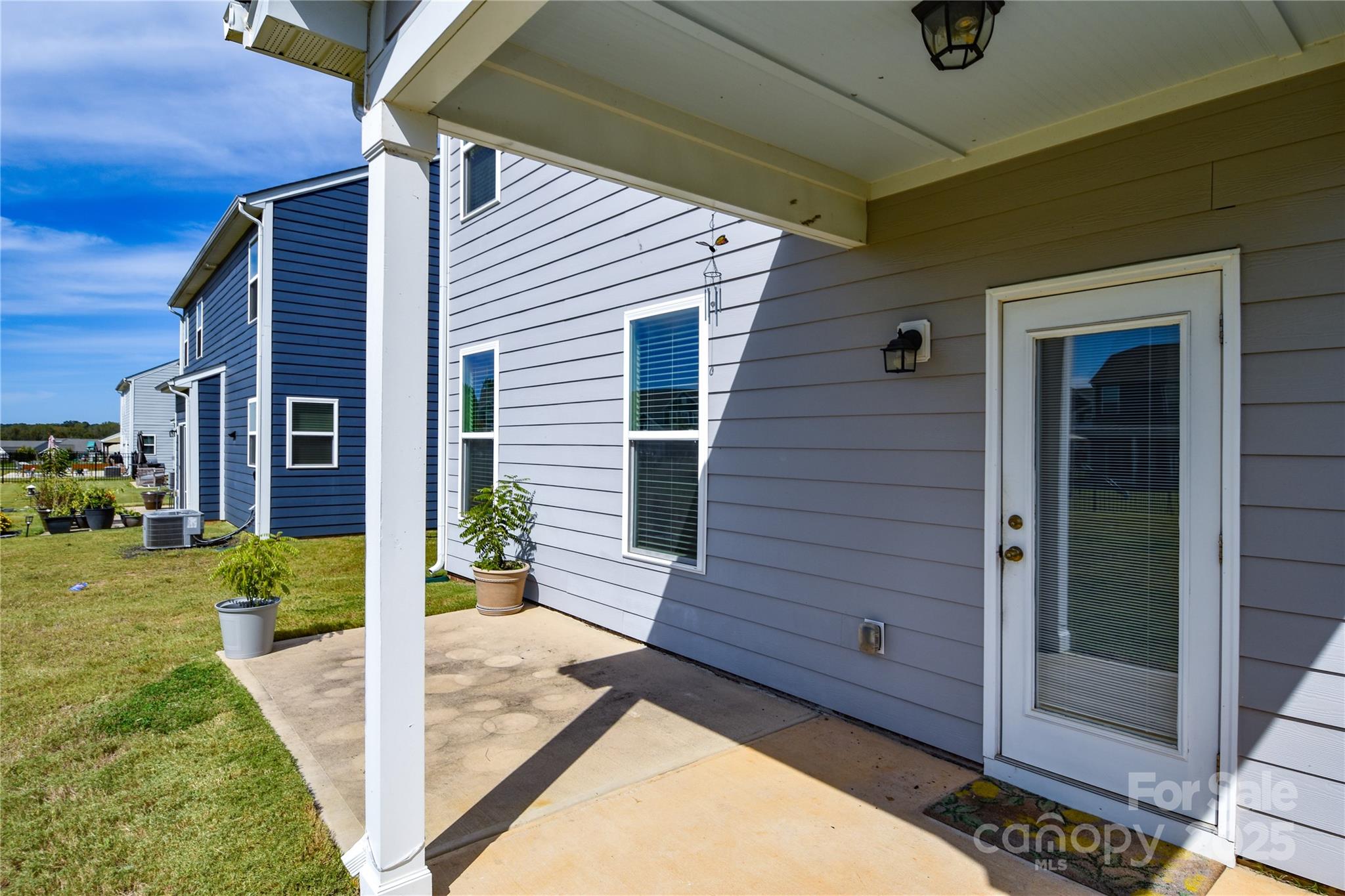 139 West Neel Ranch Road Mooresville, NC 28115 - Photo 33 of 40 a view of a house with backyard and porch