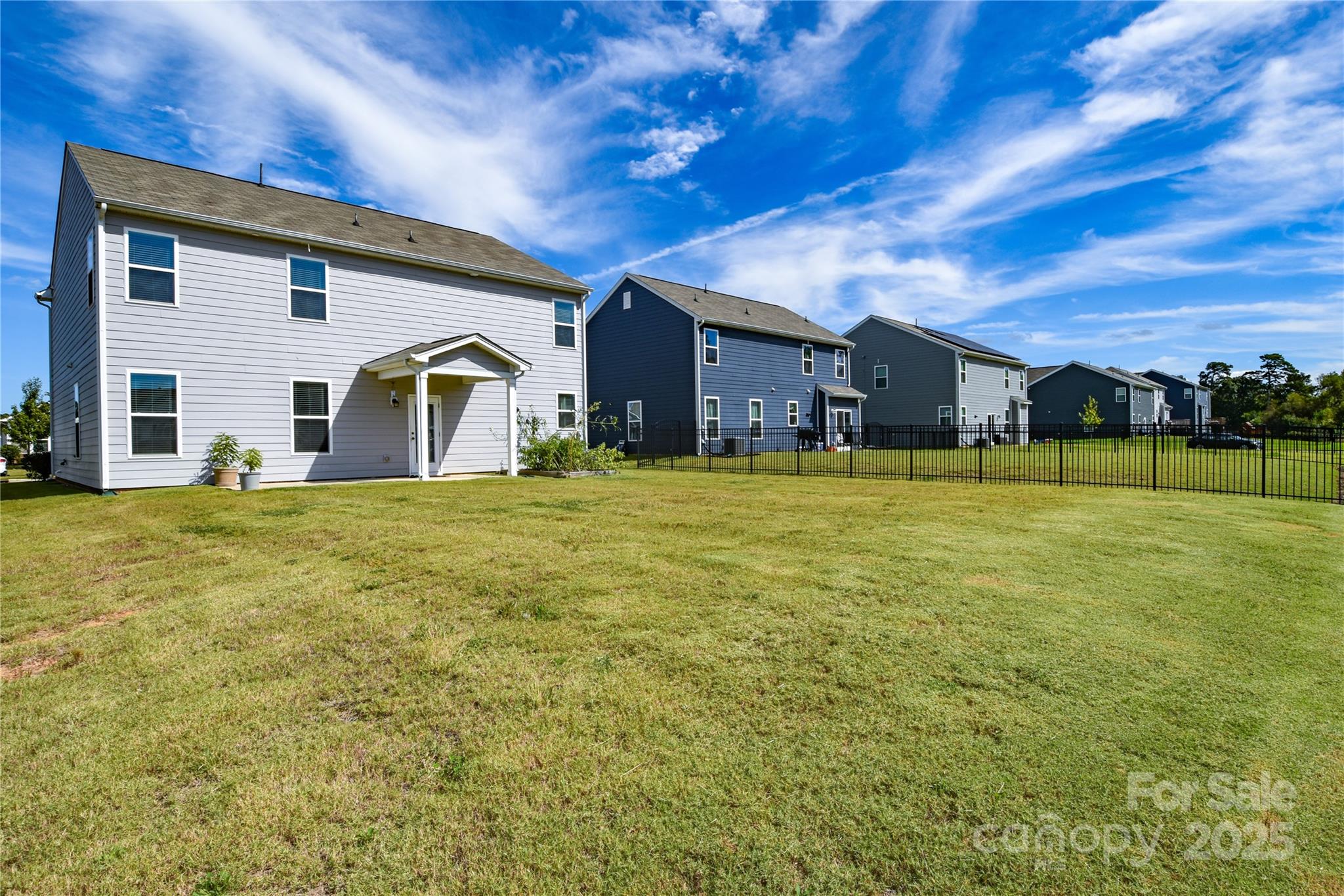 139 West Neel Ranch Road Mooresville, NC 28115 - Photo 36 of 40 a view of a house with a yard
