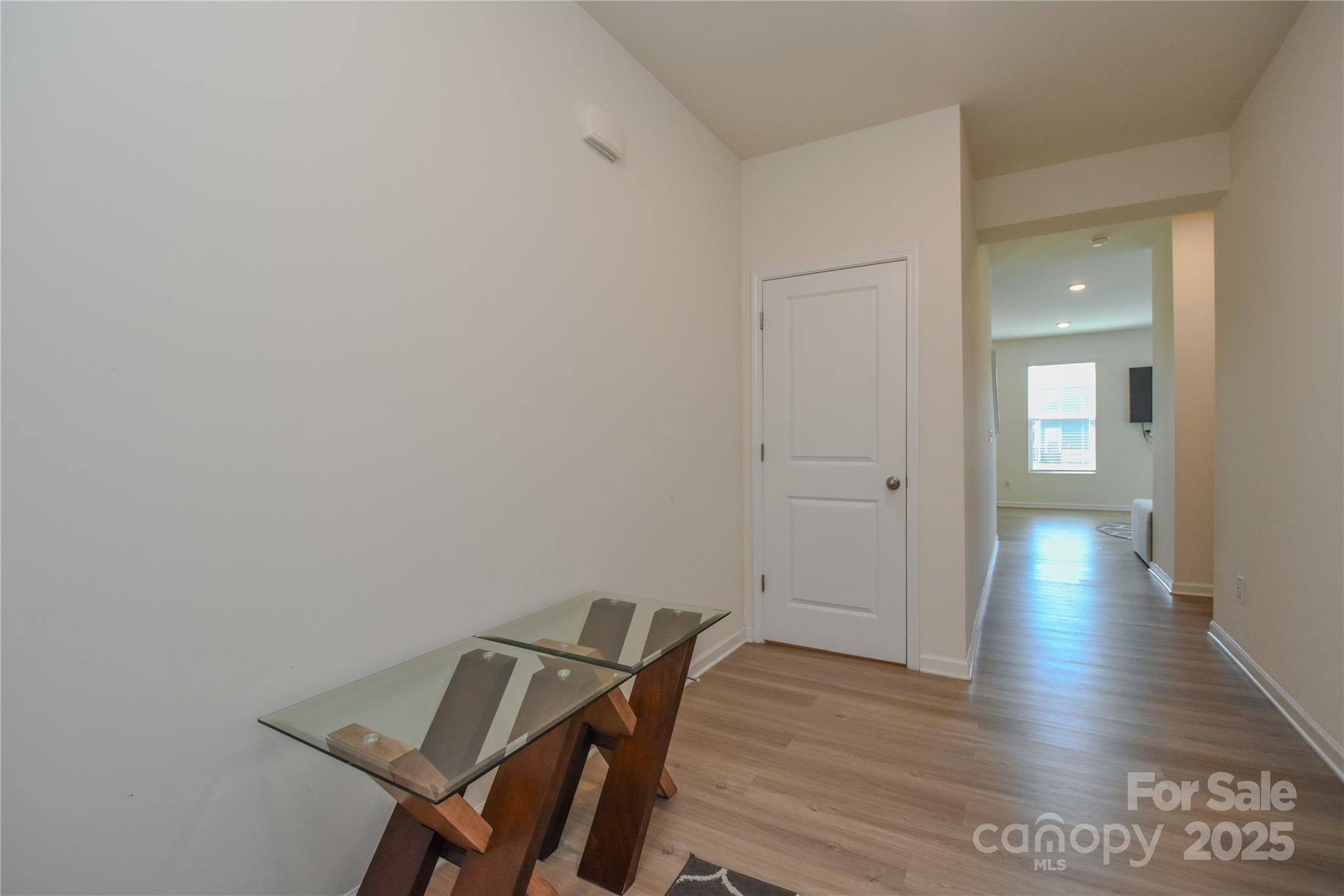 139 West Neel Ranch Road Mooresville, NC 28115 - Photo 4 of 40 a view of a hallway with wooden floor