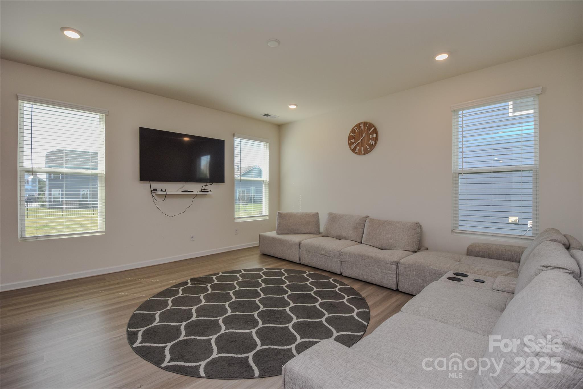 139 West Neel Ranch Road Mooresville, NC 28115 - Photo 5 of 40 a living room with furniture and a flat screen tv
