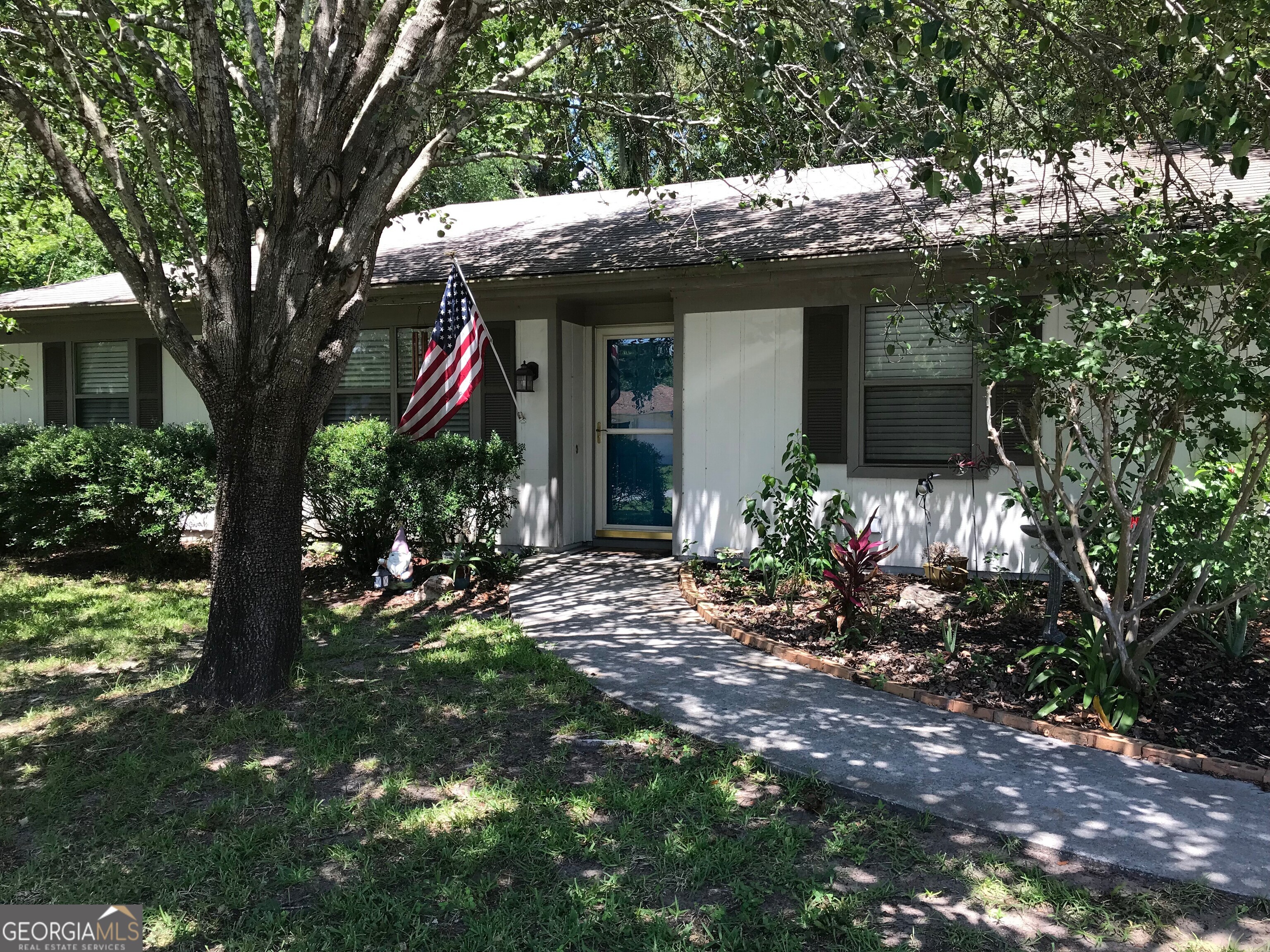 390 Powderhorn Road St. Marys, GA 31558 - Photo 1 of 18 a view of a house with a tree in front of it