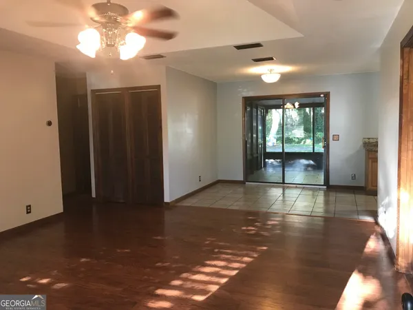 a view of livingroom with furniture wooden floor and window