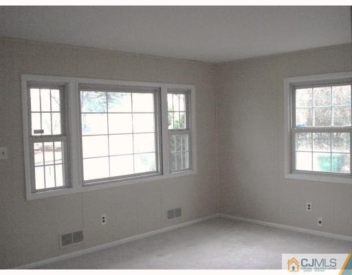 6 Sine Road Edison, NJ 08817 - Photo 3 of 10 an empty room with a window
