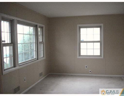 6 Sine Road Edison, NJ 08817 - Photo 4 of 10 an empty room with a window