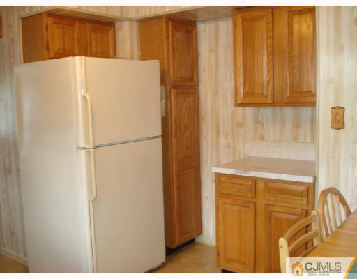 6 Sine Road Edison, NJ 08817 - Photo 5 of 10 a white refrigerator freezer sitting in a kitchen