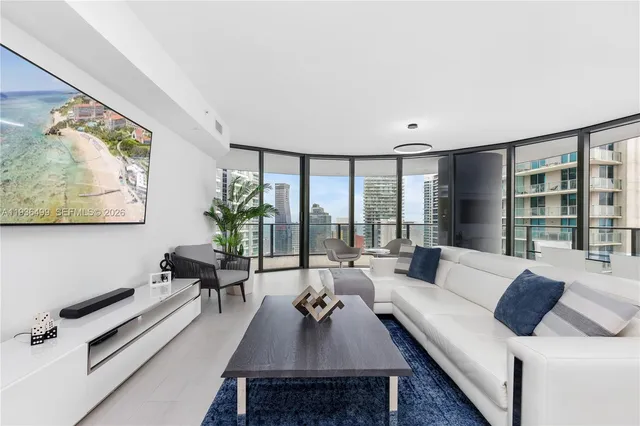 a living room with furniture and a large window