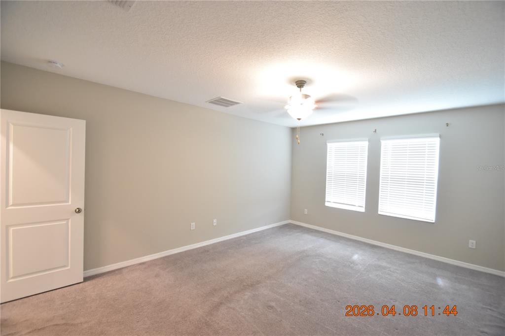 2187 Old Mining Road Lakeland, FL 33801 - Photo 22 of 65 an empty room with windows and closet