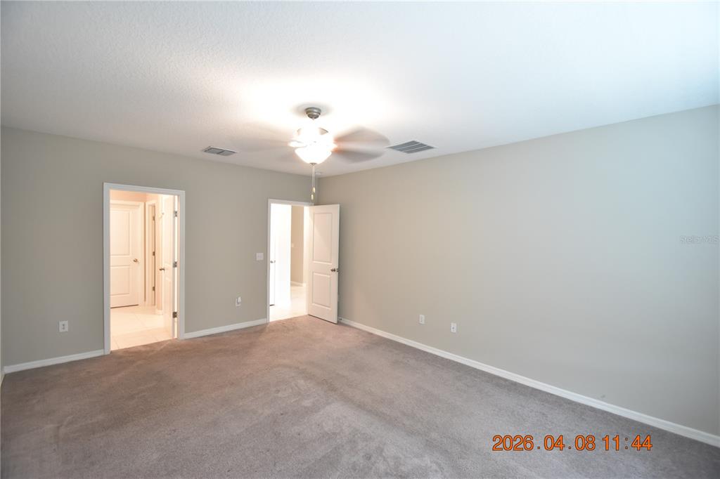 2187 Old Mining Road Lakeland, FL 33801 - Photo 23 of 65 a view of an empty room and a chandelier fan