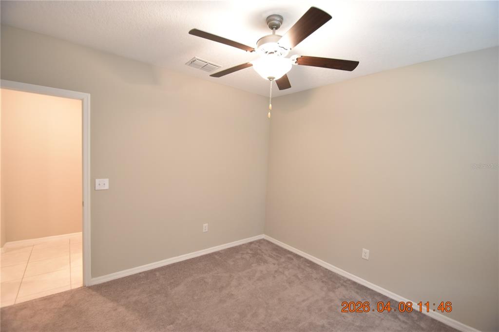 2187 Old Mining Road Lakeland, FL 33801 - Photo 32 of 65 an empty room with a window and a fan