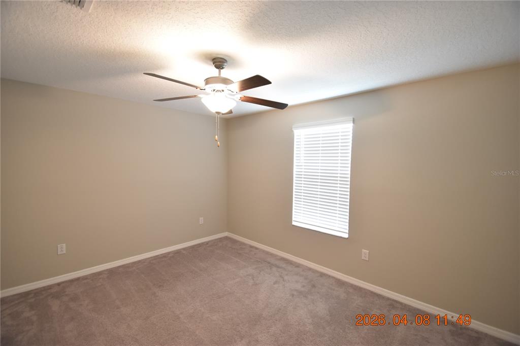 2187 Old Mining Road Lakeland, FL 33801 - Photo 40 of 65 an empty room with a window and a fan