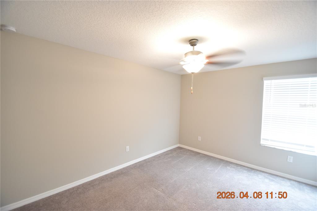 2187 Old Mining Road Lakeland, FL 33801 - Photo 44 of 65 a view of a room with a ceiling fan and a window