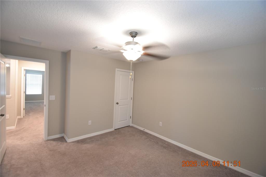 2187 Old Mining Road Lakeland, FL 33801 - Photo 51 of 65 a view of an empty room with a chandelier fan