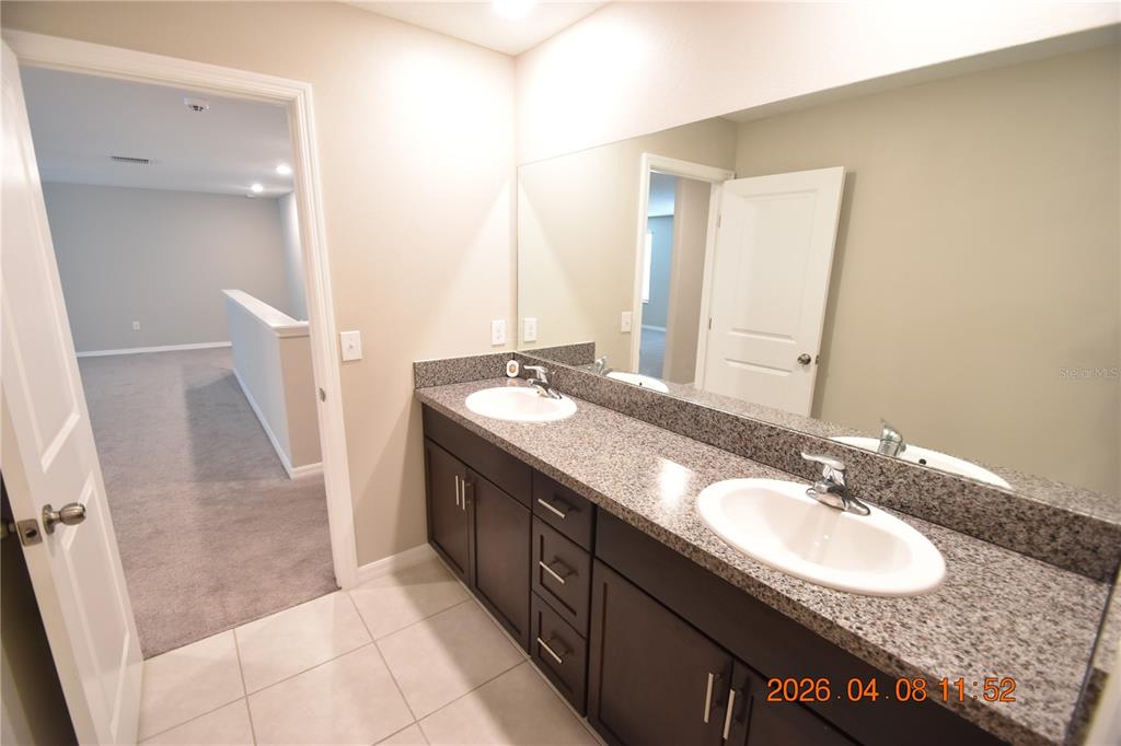 2187 Old Mining Road Lakeland, FL 33801 - Photo 57 of 65 a bathroom with a sink and a mirror