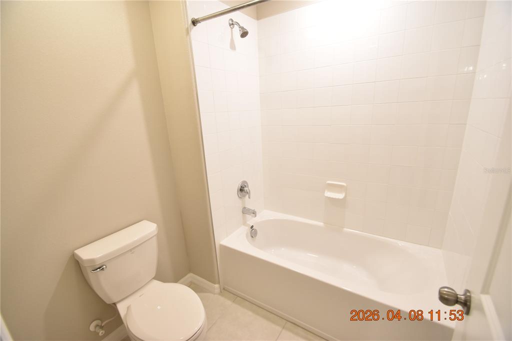 2187 Old Mining Road Lakeland, FL 33801 - Photo 58 of 65 a bathroom with a toilet and a bathtub