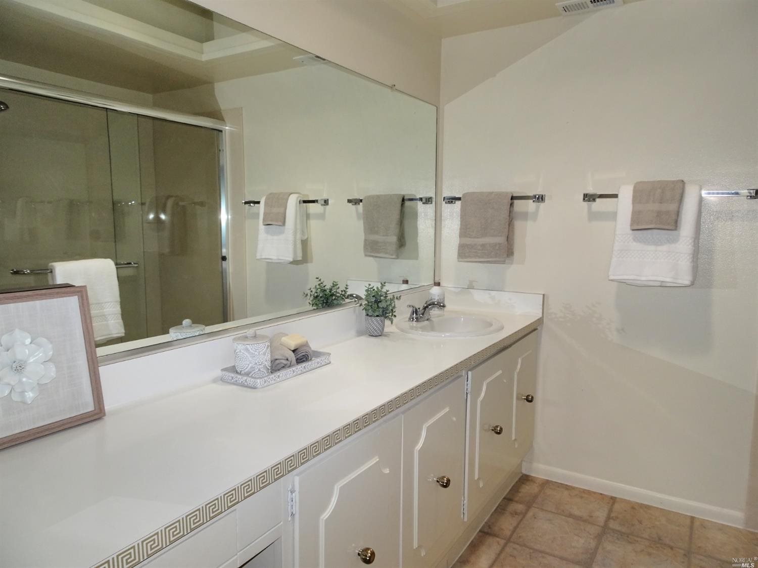 6 Woodgreen Street Santa Rosa, CA 95409 - Photo 11 of 16 a bathroom with a sink double vanity and a mirror