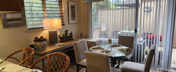 a view of a room with furniture and a window