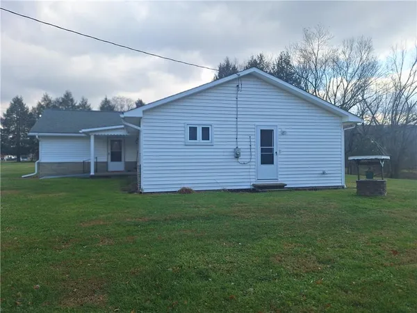 a view of a backyard of the house