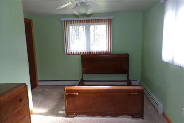 a living room with a window and a couch