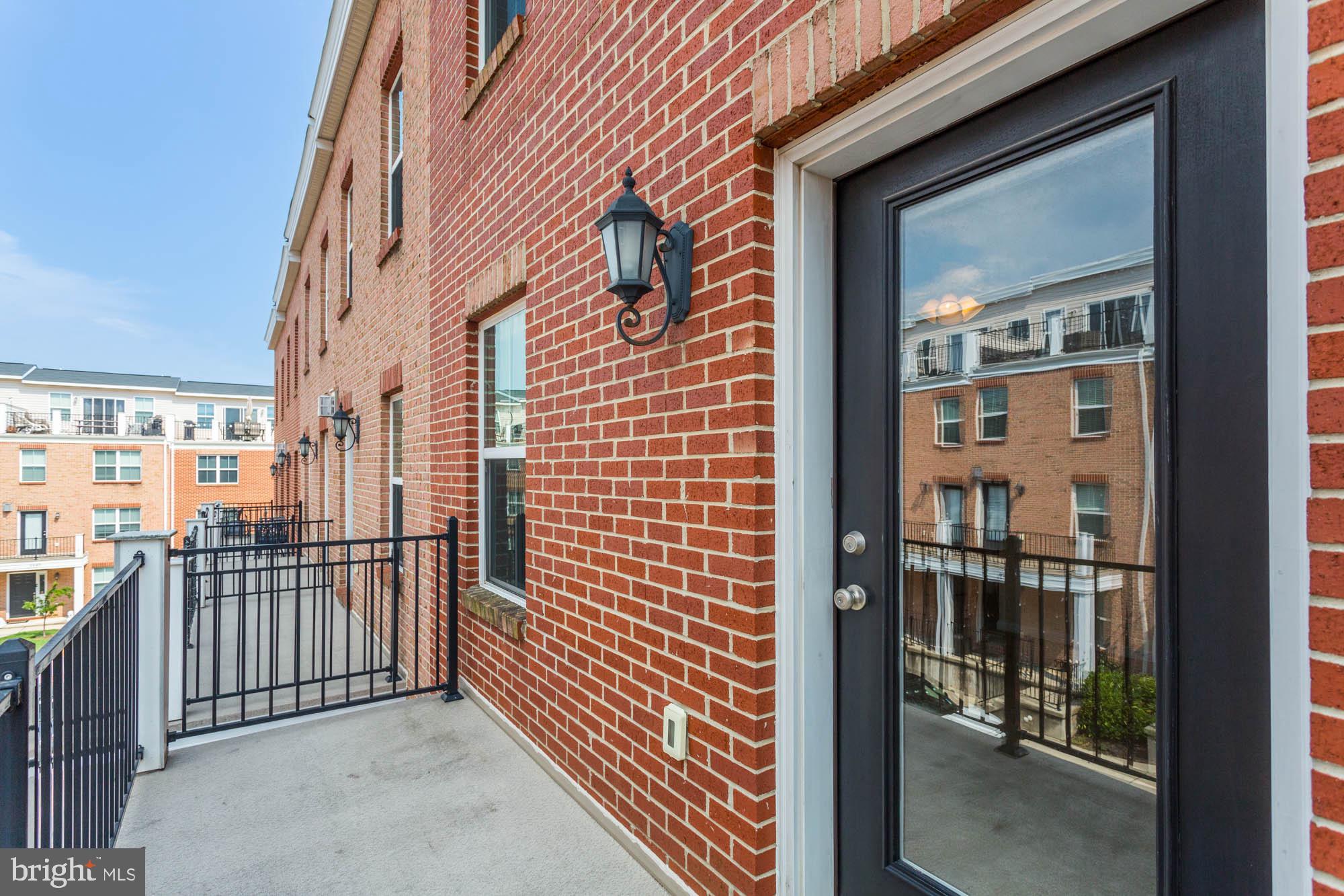 4625 Dillon Place Baltimore, MD 21224 - Photo 21 of 41 Bedroom 1 balcony door and patio