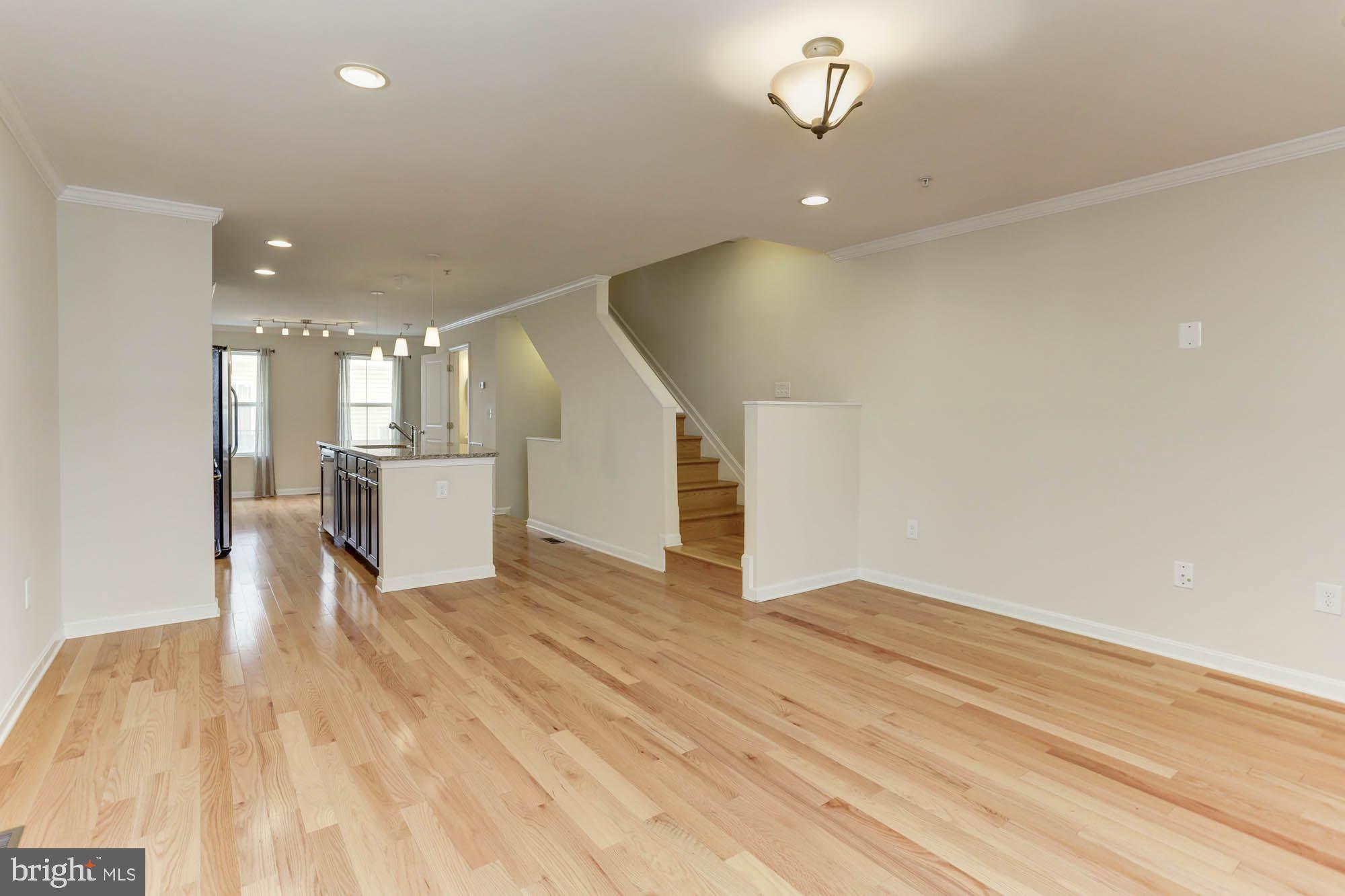 4625 Dillon Place Baltimore, MD 21224 - Photo 6 of 41 Living room to kitchen