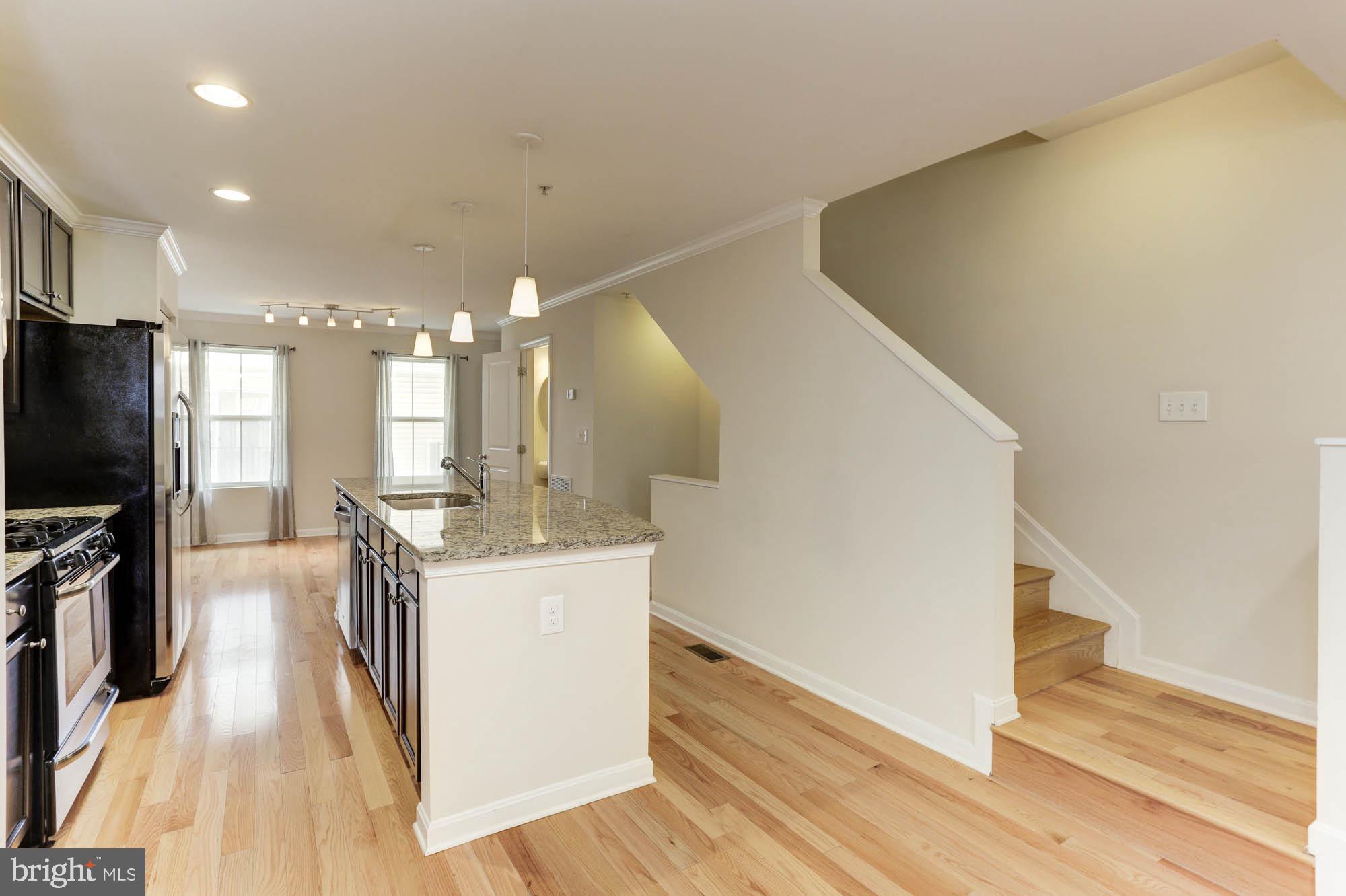 4625 Dillon Place Baltimore, MD 21224 - Photo 7 of 41 Living room to kitchen