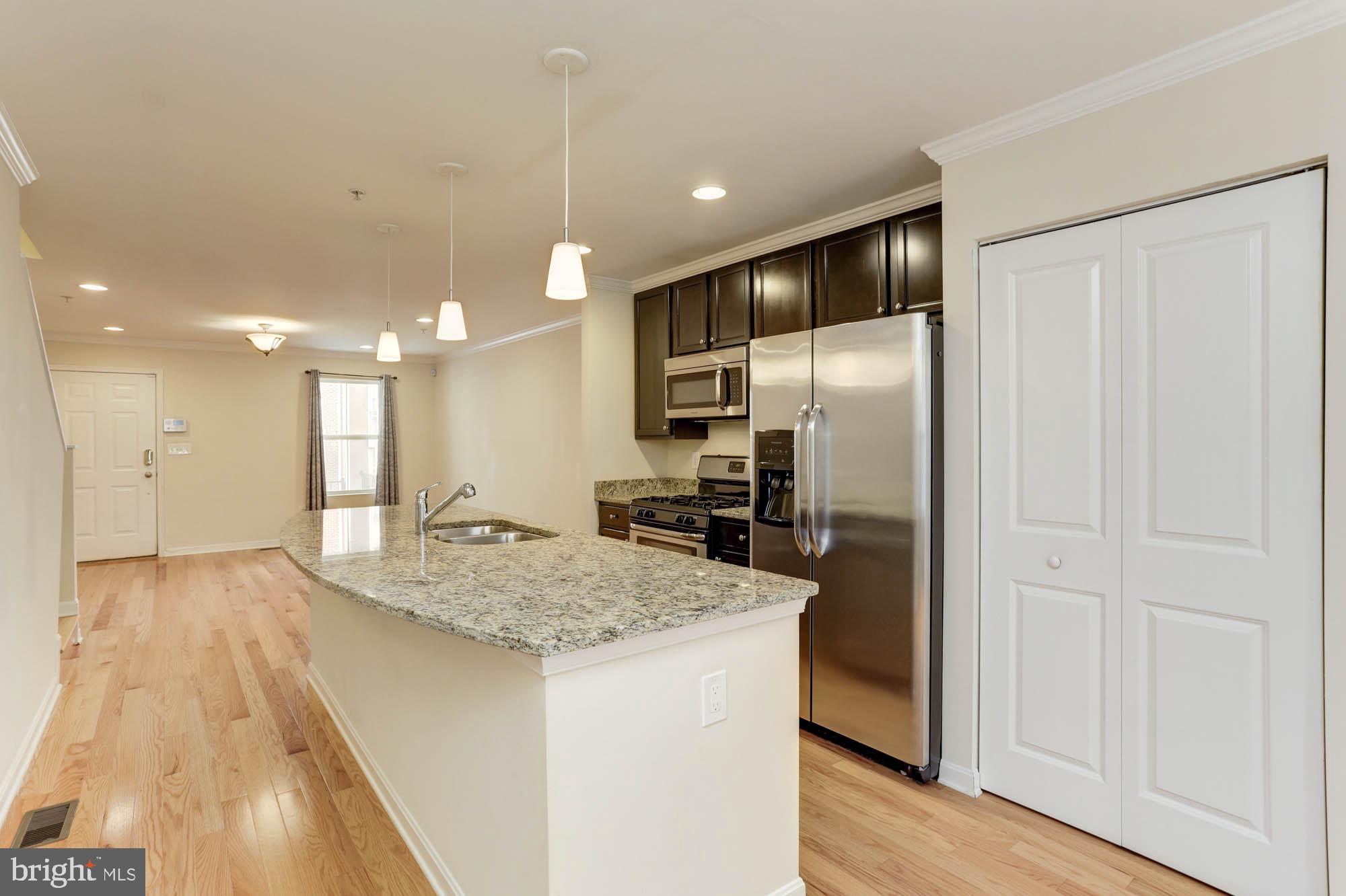 4625 Dillon Place Baltimore, MD 21224 - Photo 10 of 41 Kitchen to living room view