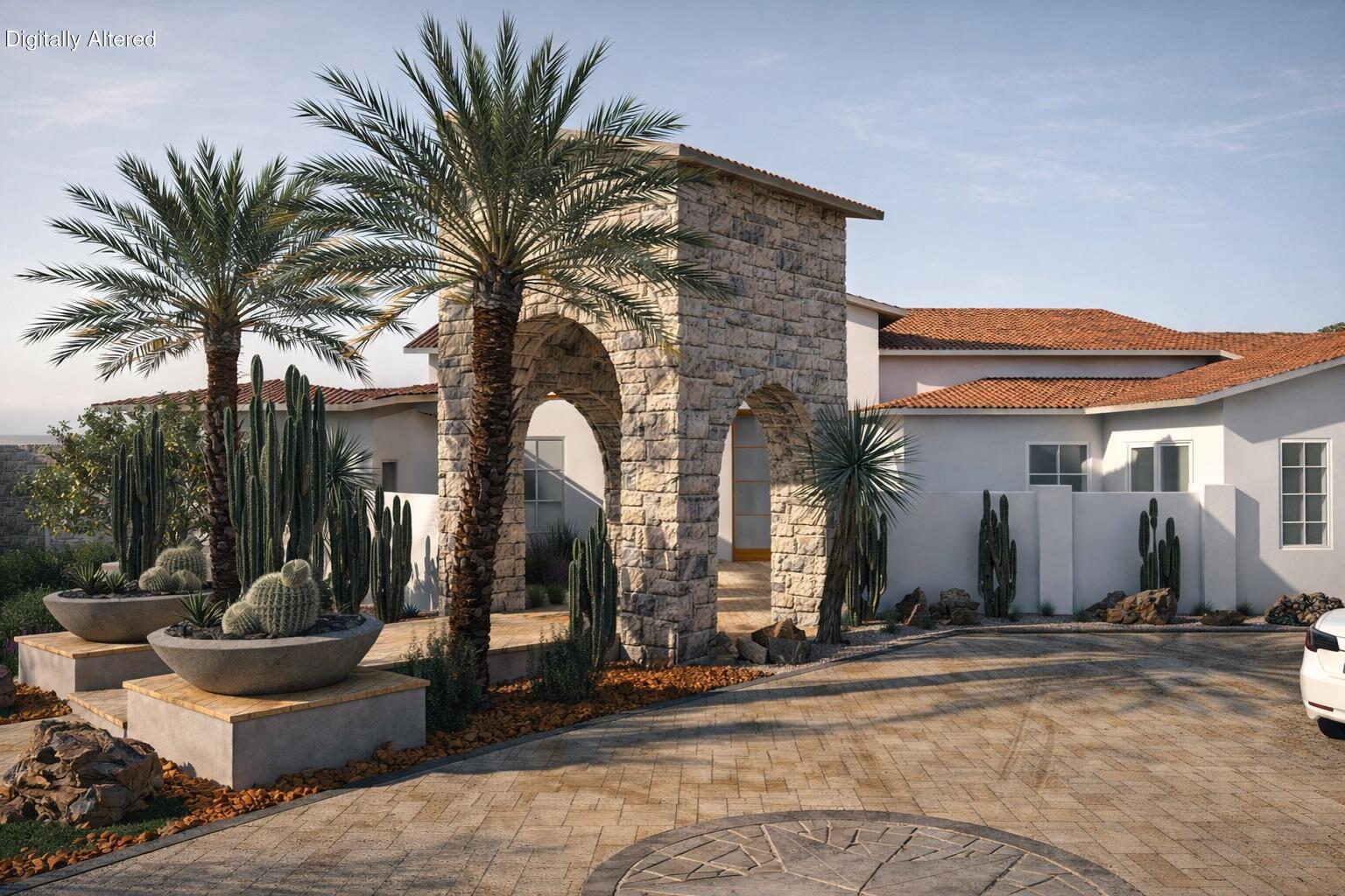 1 Via Perugia Rancho Mirage, CA 92270 - Photo 2 of 19 a front view of a house with outdoor seating and a garage