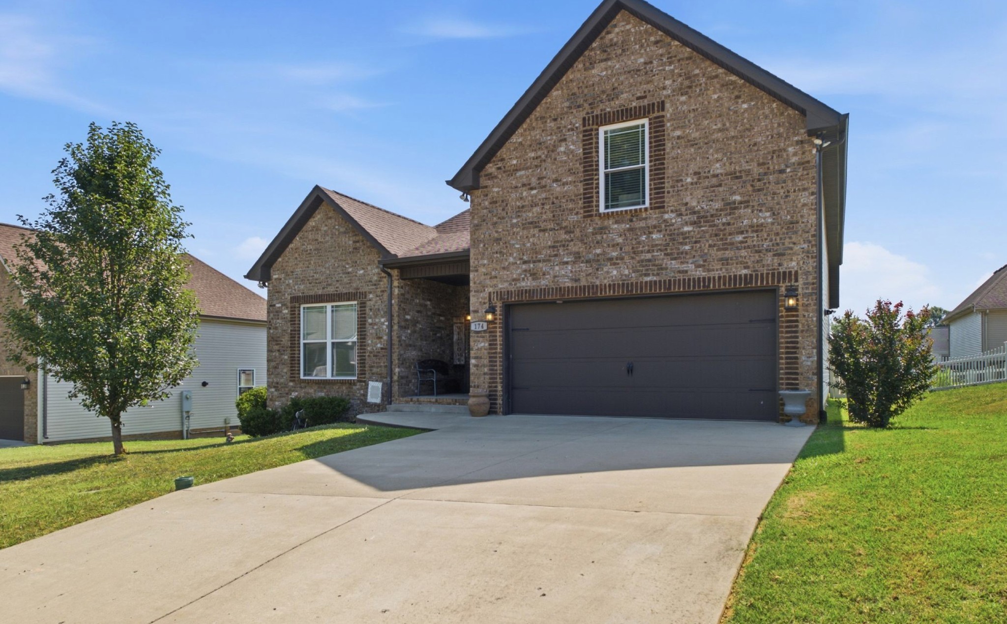 174 Fieldstone Lane Springfield, TN 37172 - Photo 3 of 32 a front view of a house with a yard and garage