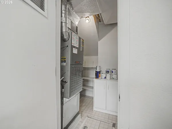 a view of storage and utility room with washer and dryer