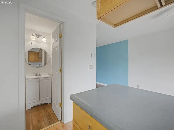 a view of a kitchen cabinets and wooden floor
