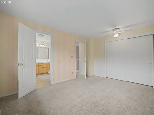an empty room with closet area