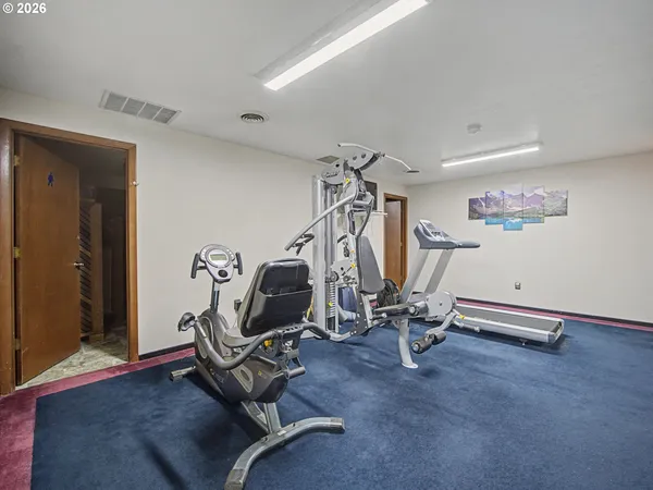 a view of a room with gym equipment