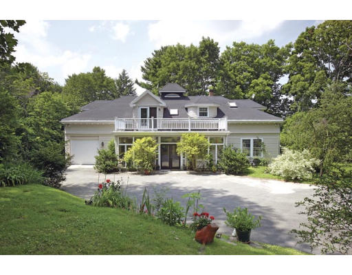 1421 Brush Hill Road Milton, MA 02186 - Photo 1 of 1 a front view of a house with a garden and porch