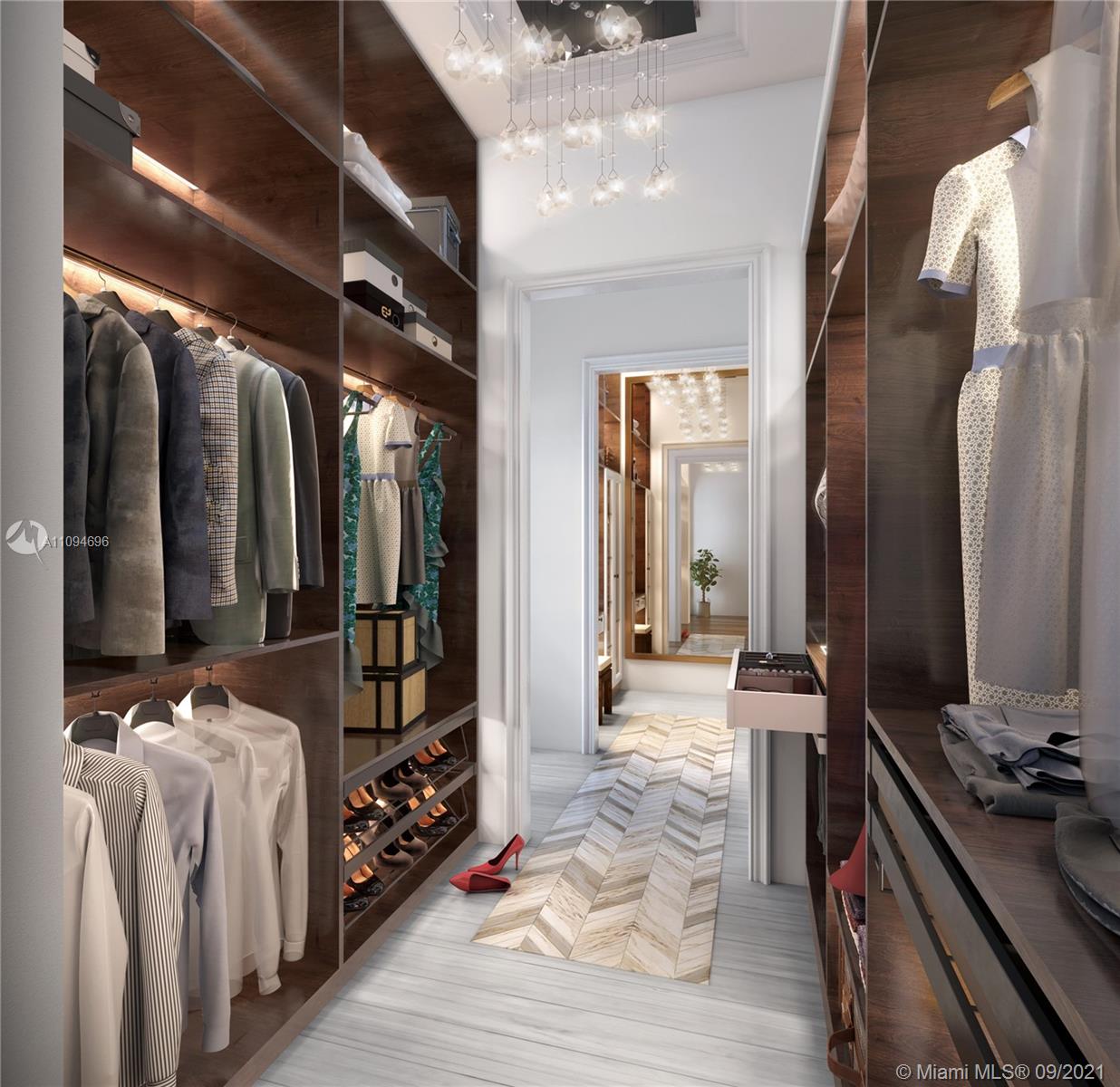 5465 Pine Tree Drive Miami Beach, FL 33140 - Photo 12 of 18 a bedroom with furniture and a flat tv screen