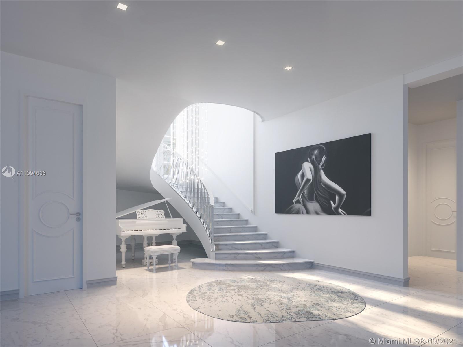 5465 Pine Tree Drive Miami Beach, FL 33140 - Photo 14 of 18 a view of entryway and hall with wooden floor