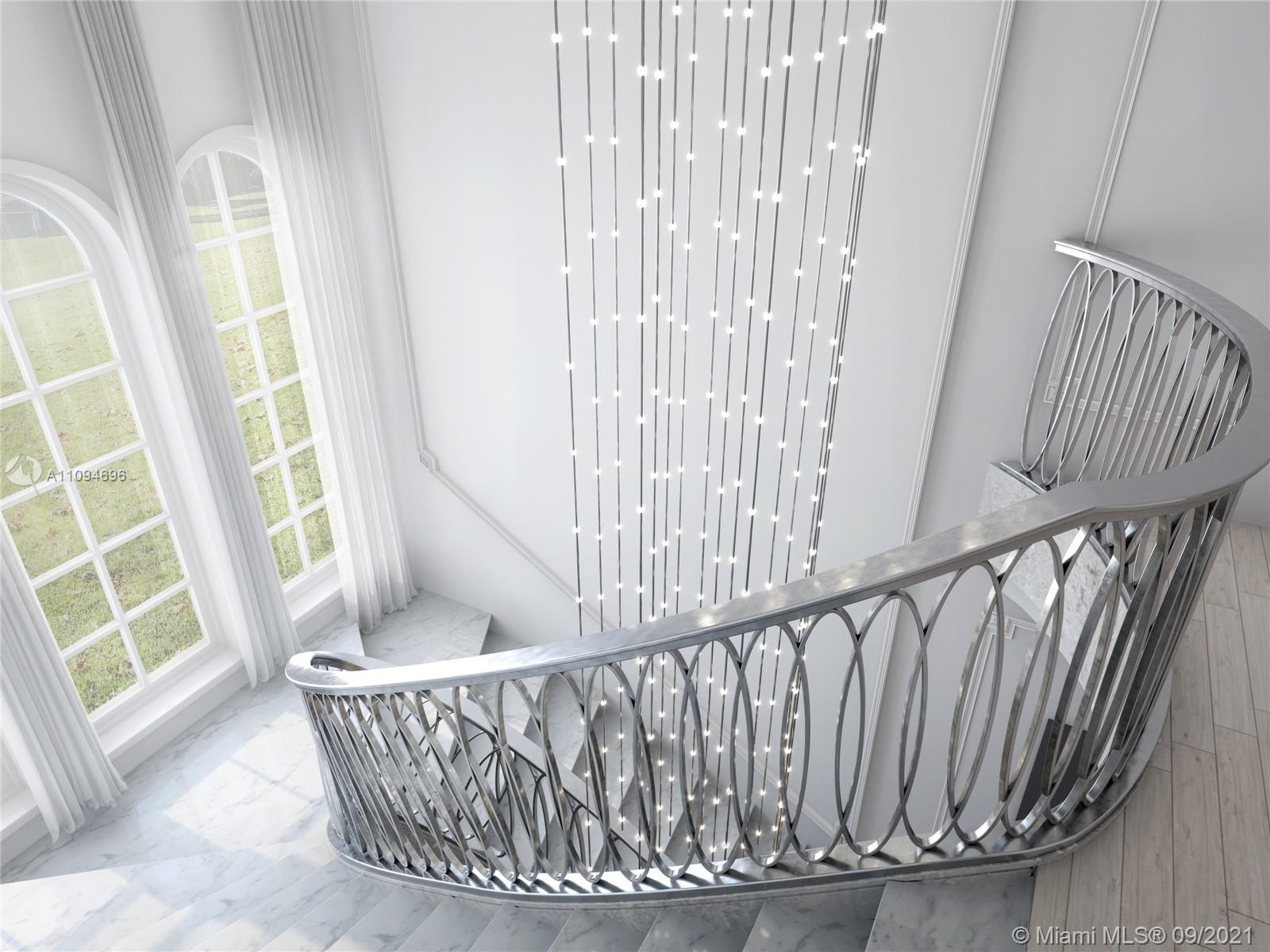 5465 Pine Tree Drive Miami Beach, FL 33140 - Photo 15 of 18 a view of entryway with wooden floor