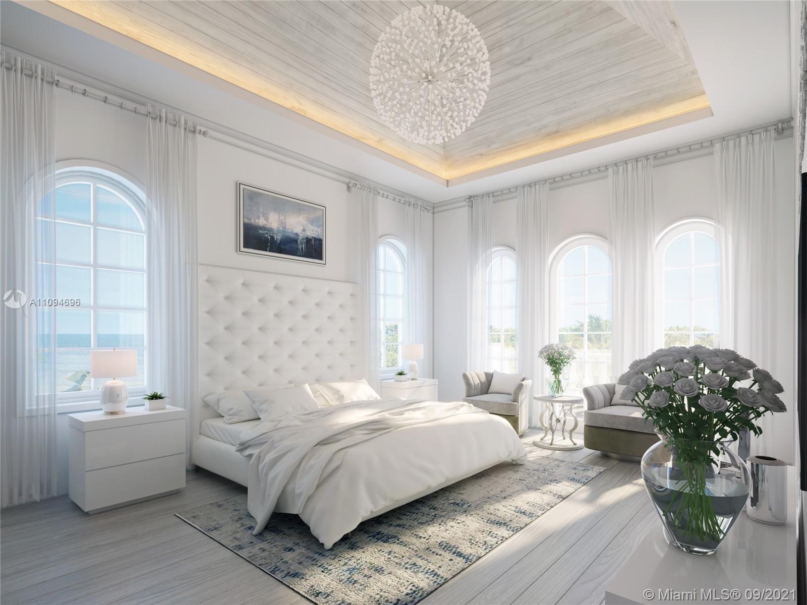 5465 Pine Tree Drive Miami Beach, FL 33140 - Photo 5 of 18 a spacious bedroom with a bed a couch and potted plant