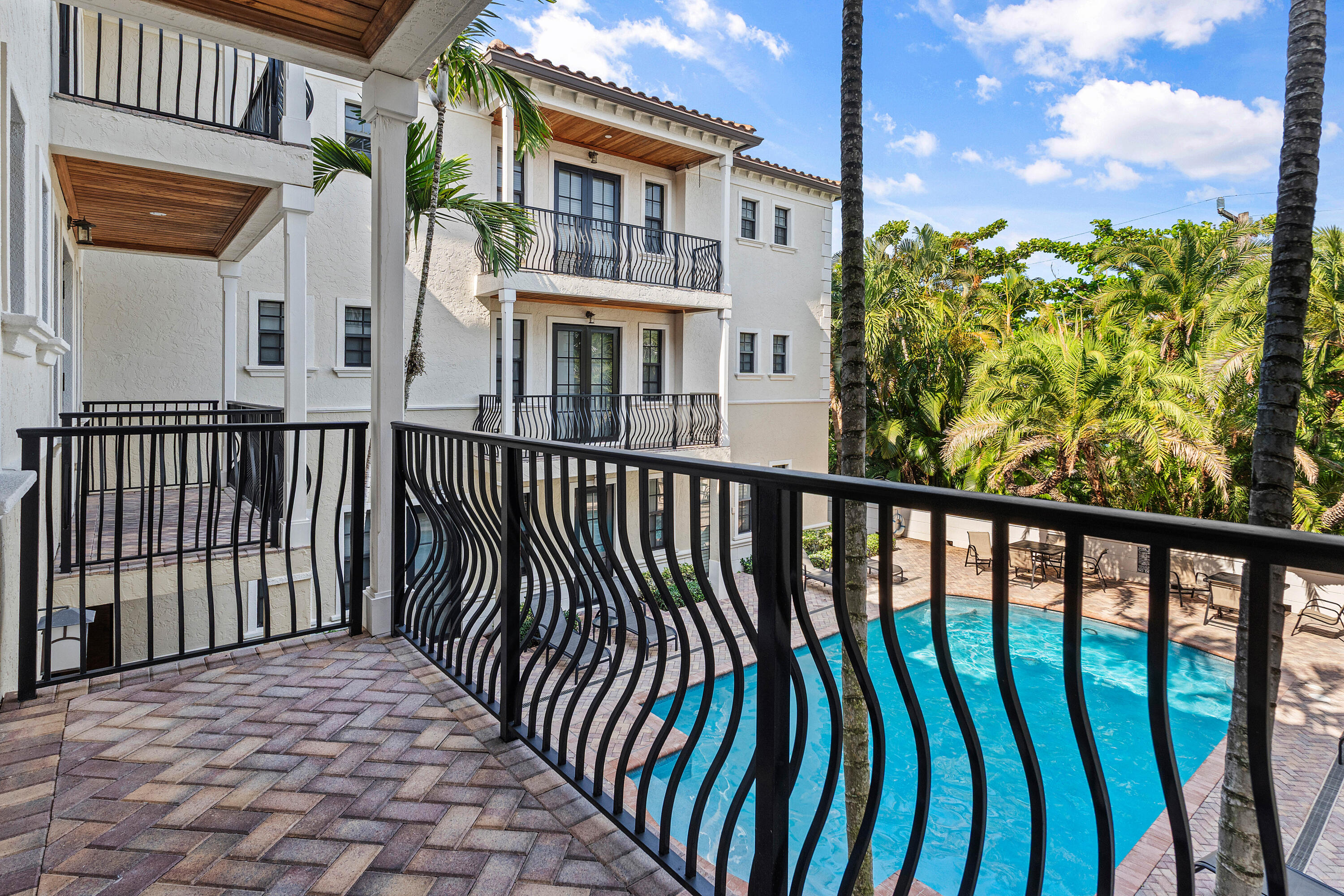 110 Gleason Street, Unit 203 Delray Beach, FL 33483 - Photo 22 of 25 a view of a brick house with a large window