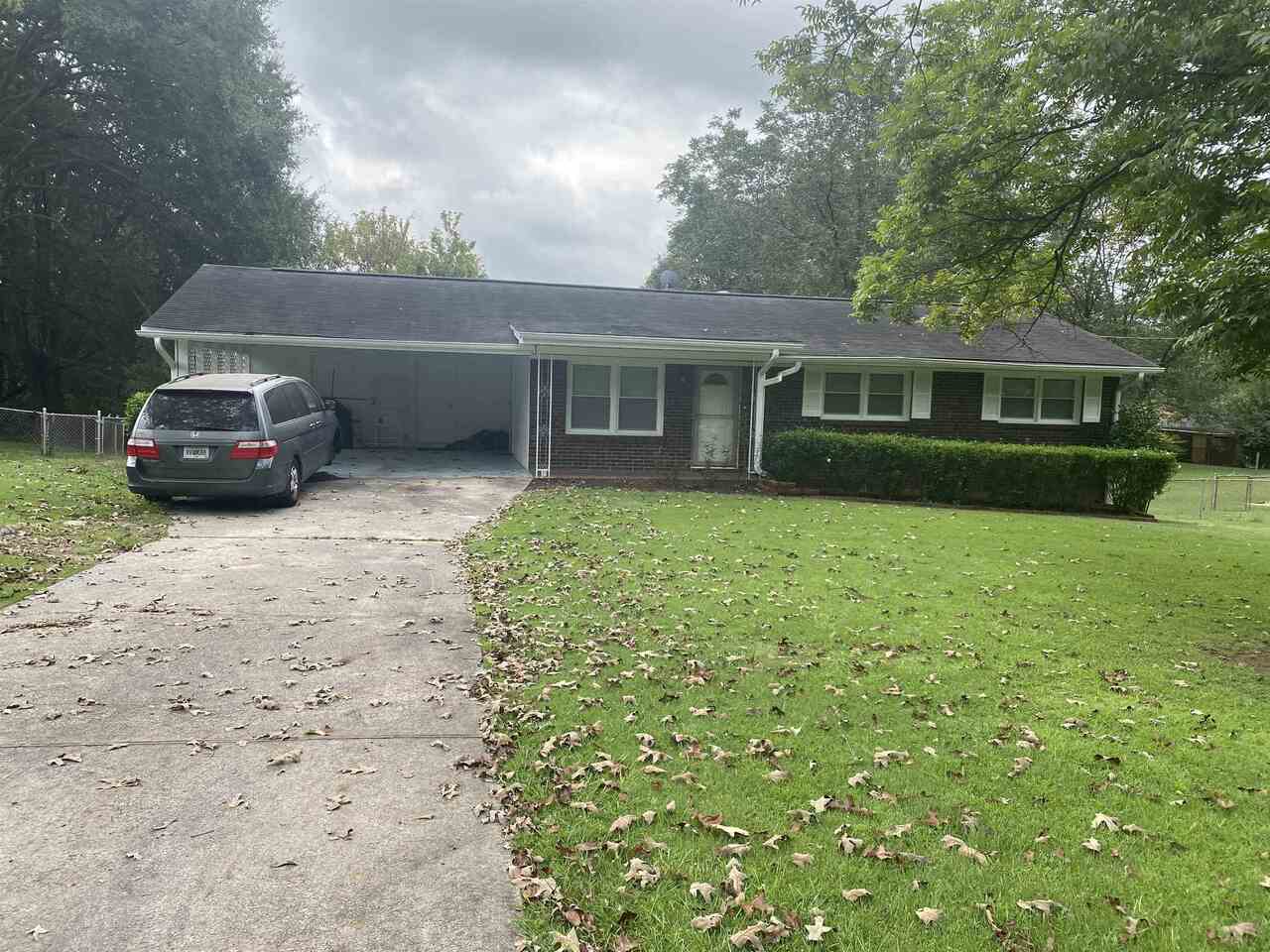 1146 East Fayetteville Road Riverdale, GA 30296 - Photo 1 of 1 a view of a house with a yard